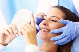 Picture of adult woman having a visit at the dentist's