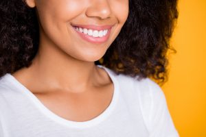 Cropped close-up profile side view portrait of her she nice attractive, lovely cheerful cheey wavy-haired girl teeth treatment isolated over bright vivid shine vibrant yellow color background
